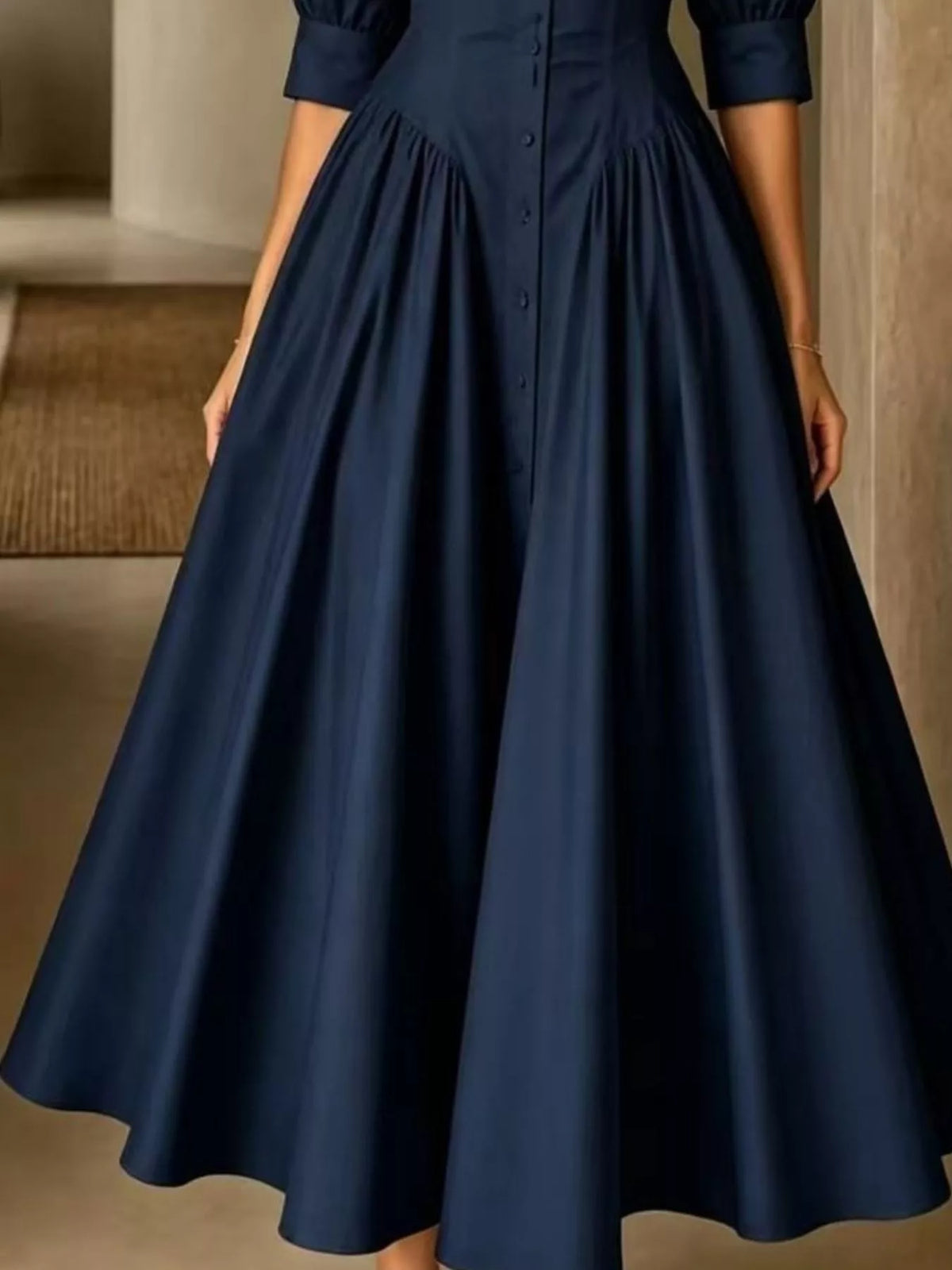 Dark navy button-down shirt dress with cinched waist and full gathered skirt, button front.