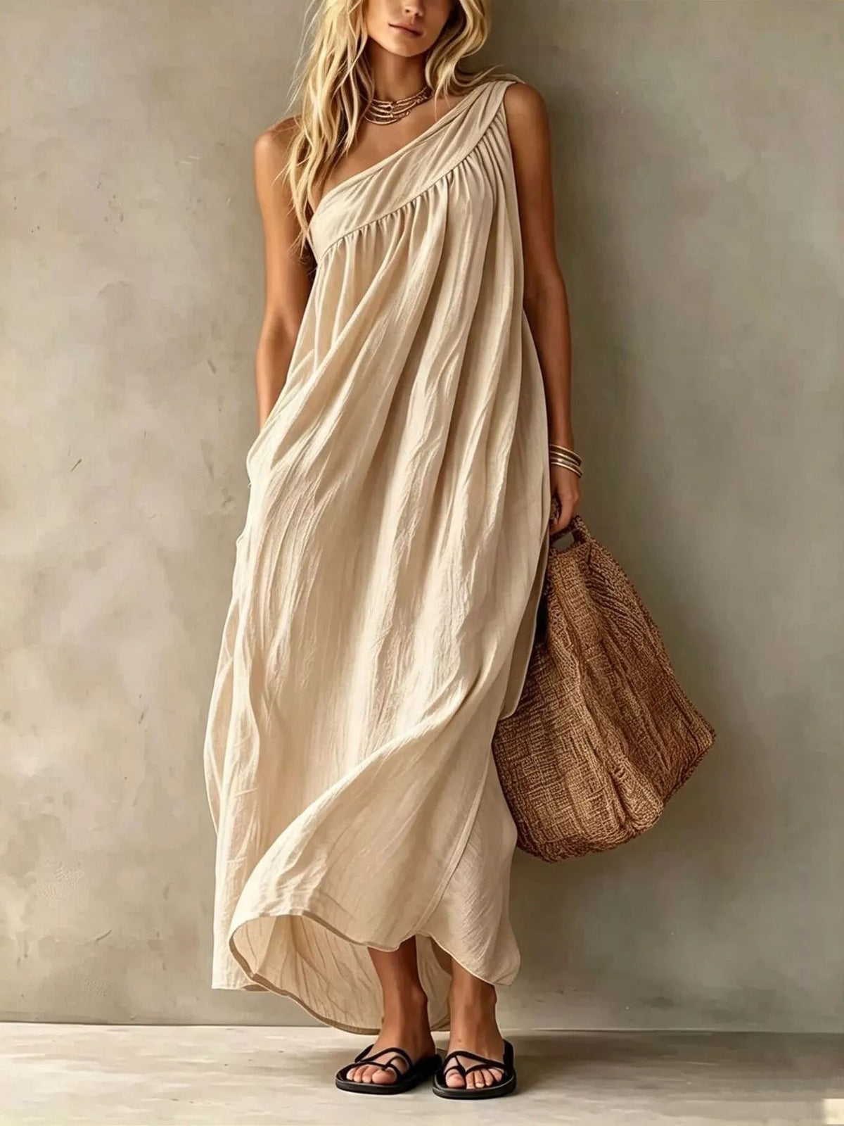 Off-white one-shoulder maxi dress with gathered neckline and relaxed, flowing fit
