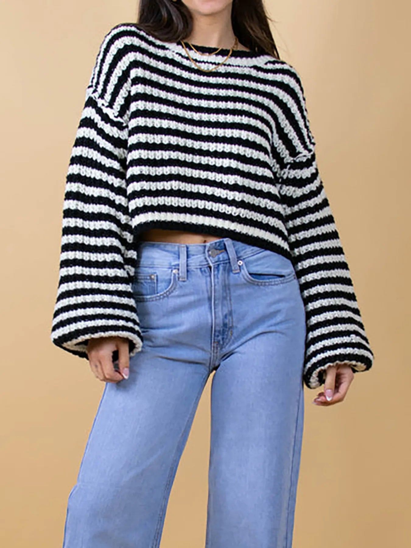 Black-and-white striped oversized drop-shoulder sweater, wide sleeves and crew neck