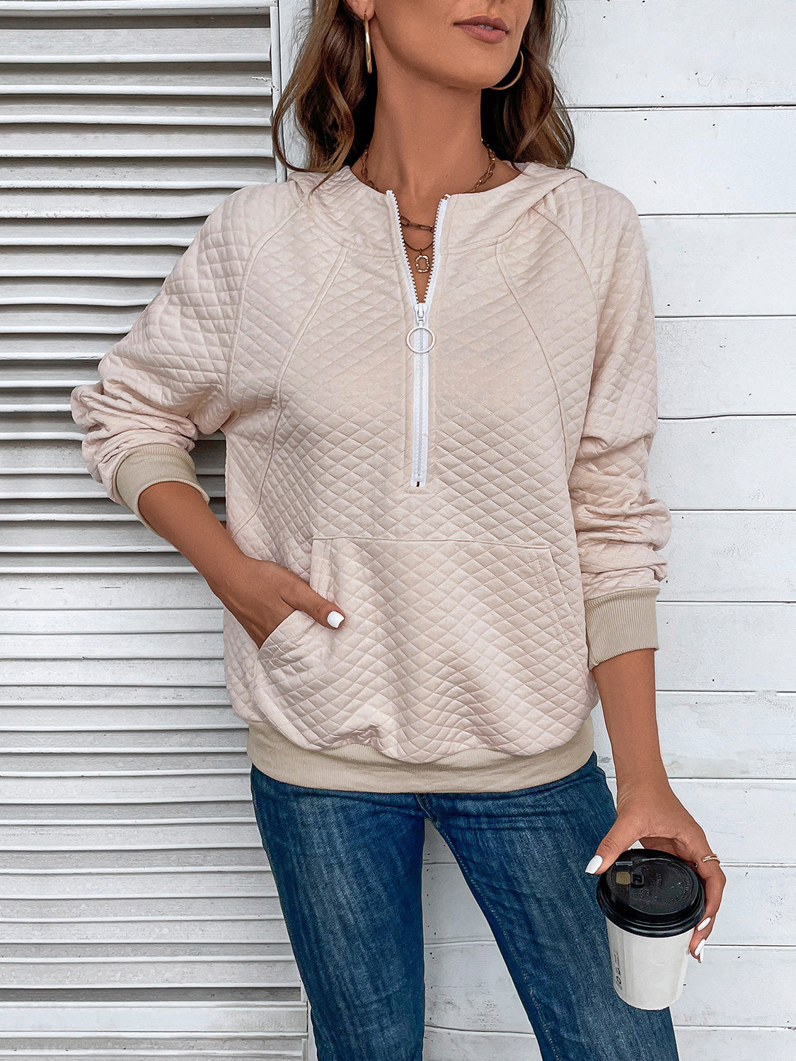 Cream quilted half-zip hoodie with hood, front half-zip and kangaroo pocket