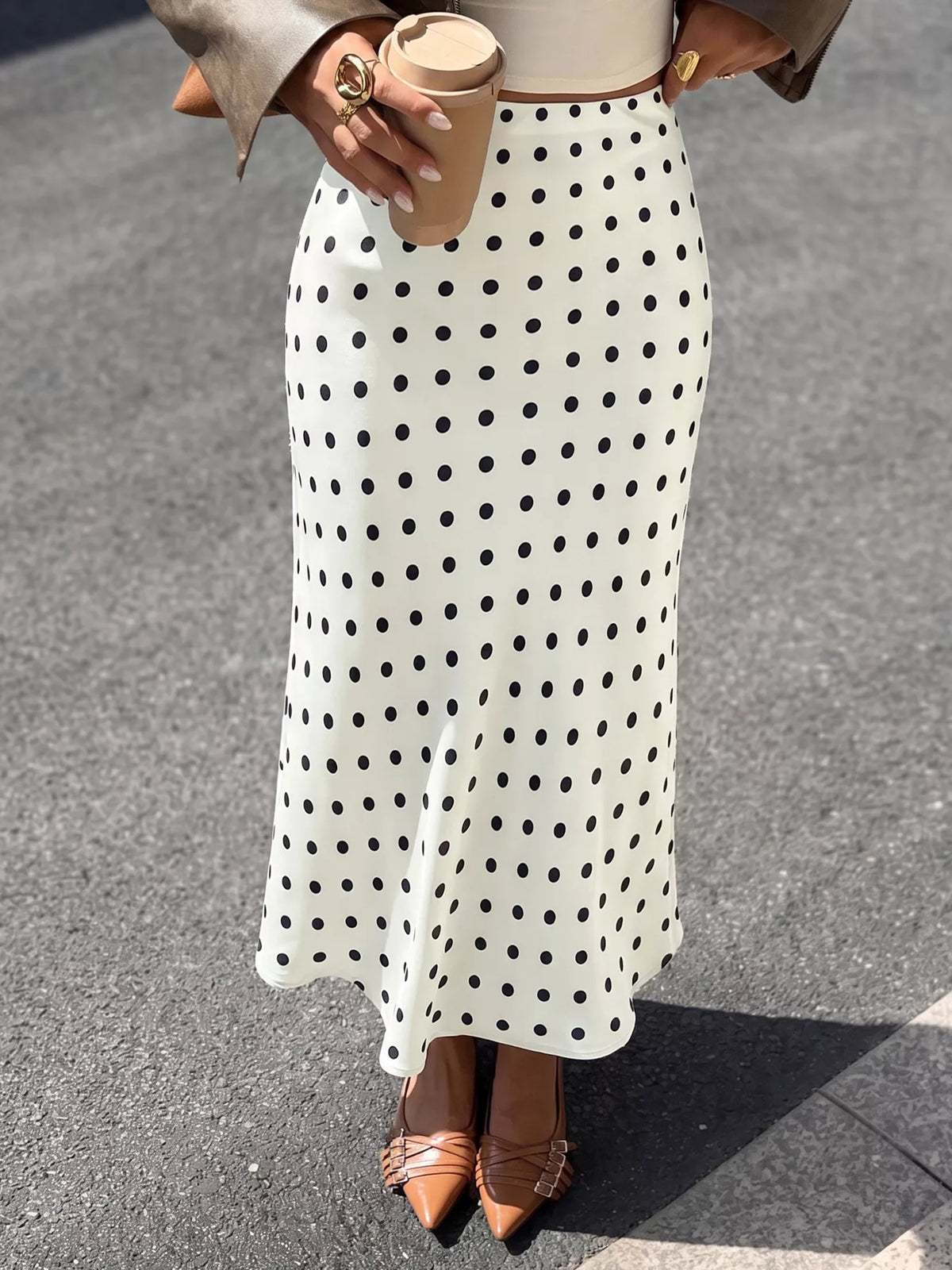Beige polka dot stretch midi skirt with elastic waistband and A-line hem