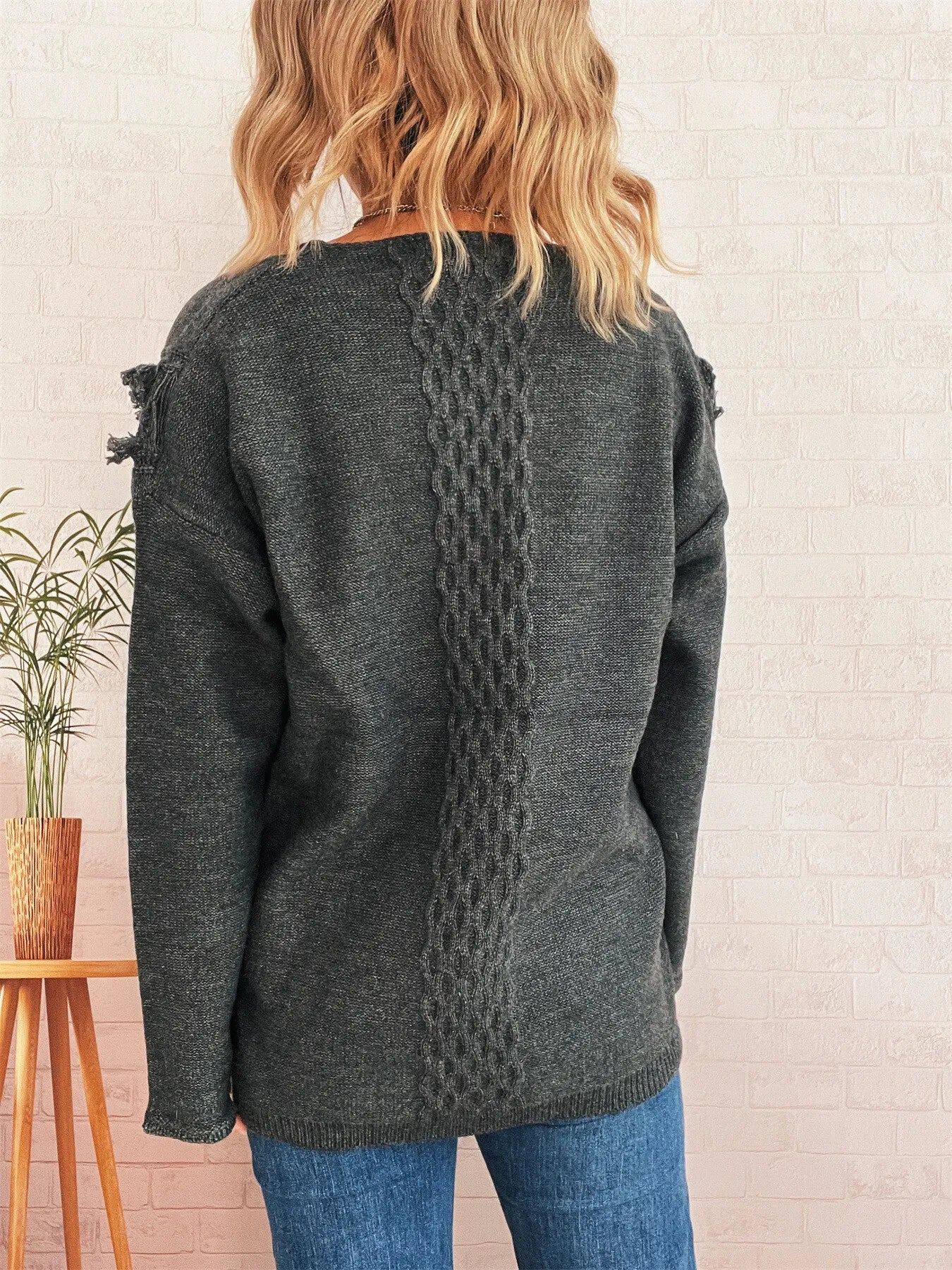Dark gray knit sweater with lace detail on back, long sleeves
