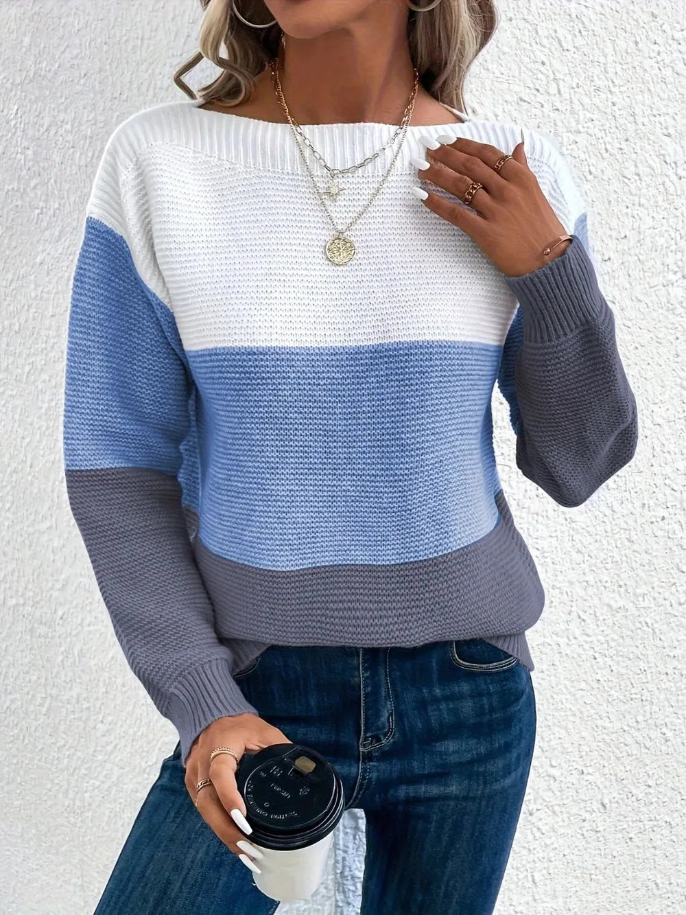 Boat-neck color block knit sweater in white, light blue, and dark gray stripes