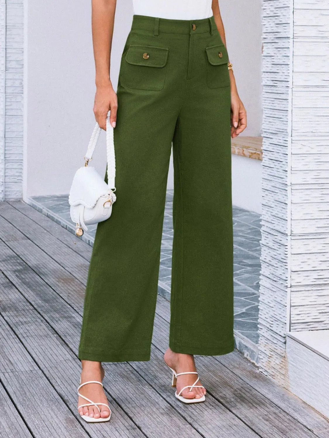 High-waist wide-leg pants, dark green with flap front pockets and gold buttons.