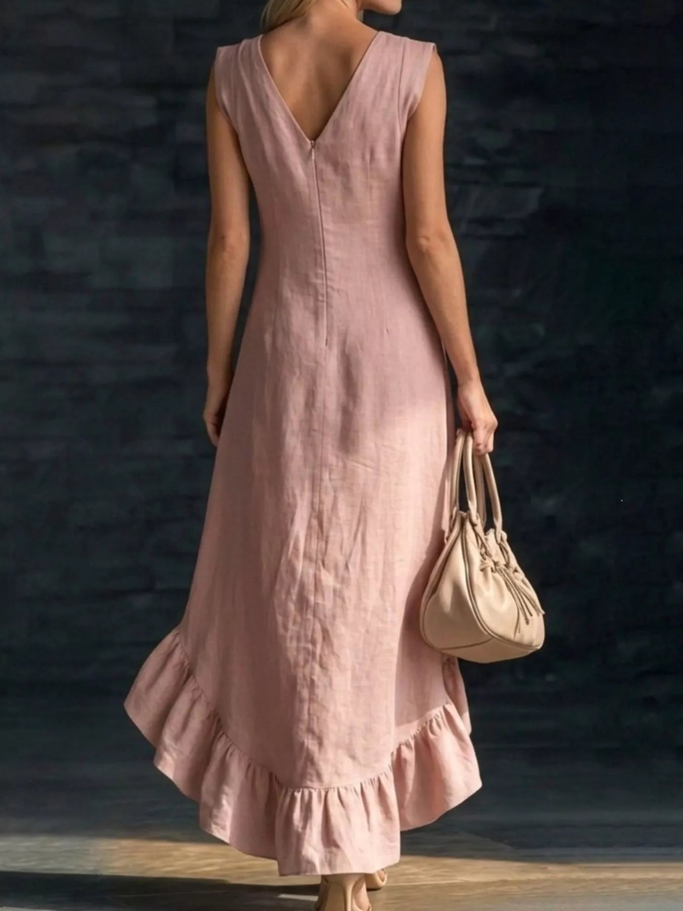 Light pink sleeveless V-neck dress with asymmetrical layered ruffle hem