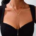 Gold-plated Y-drop pearl necklace with small bead chain and hanging pearl dangle