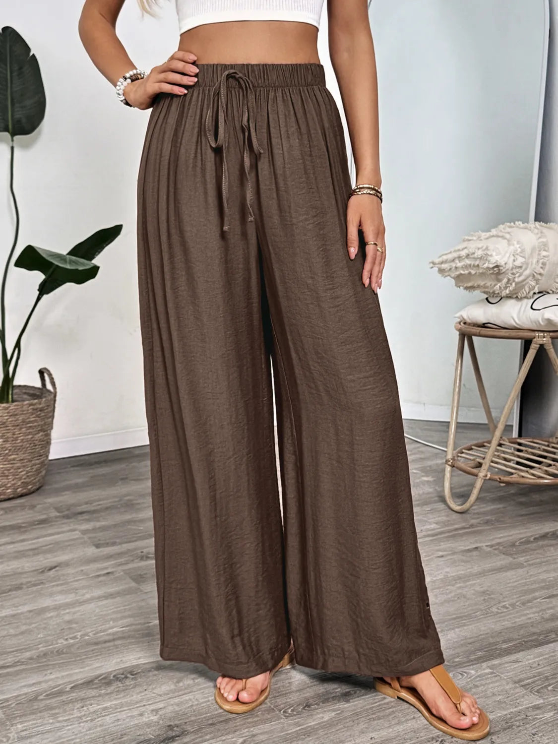 Dark brown wide-leg pants with gathered waistband and tie drawstring