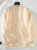 Cream open-front long sleeve cardigan on hanger, textured knit with patch pockets
