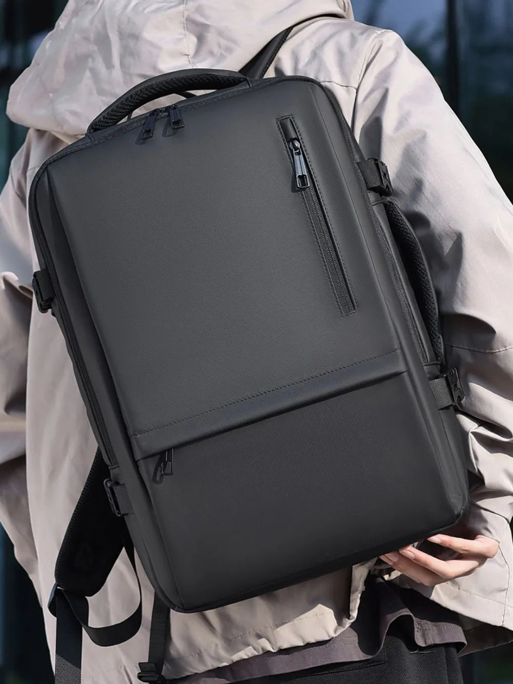 Black backpack with front zip pocket and padded shoulder straps