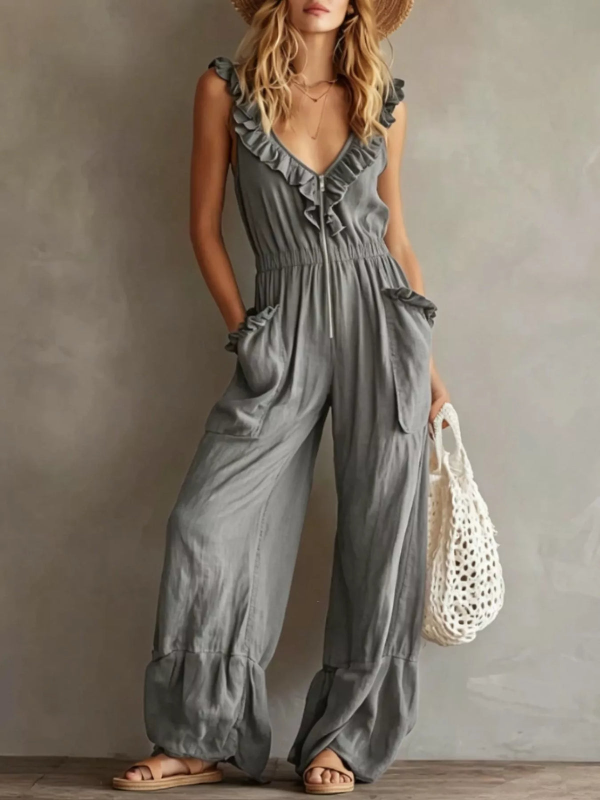 Light gray ruffled V-neck sleeveless jumpsuit with tie front and flowy wide-leg pants