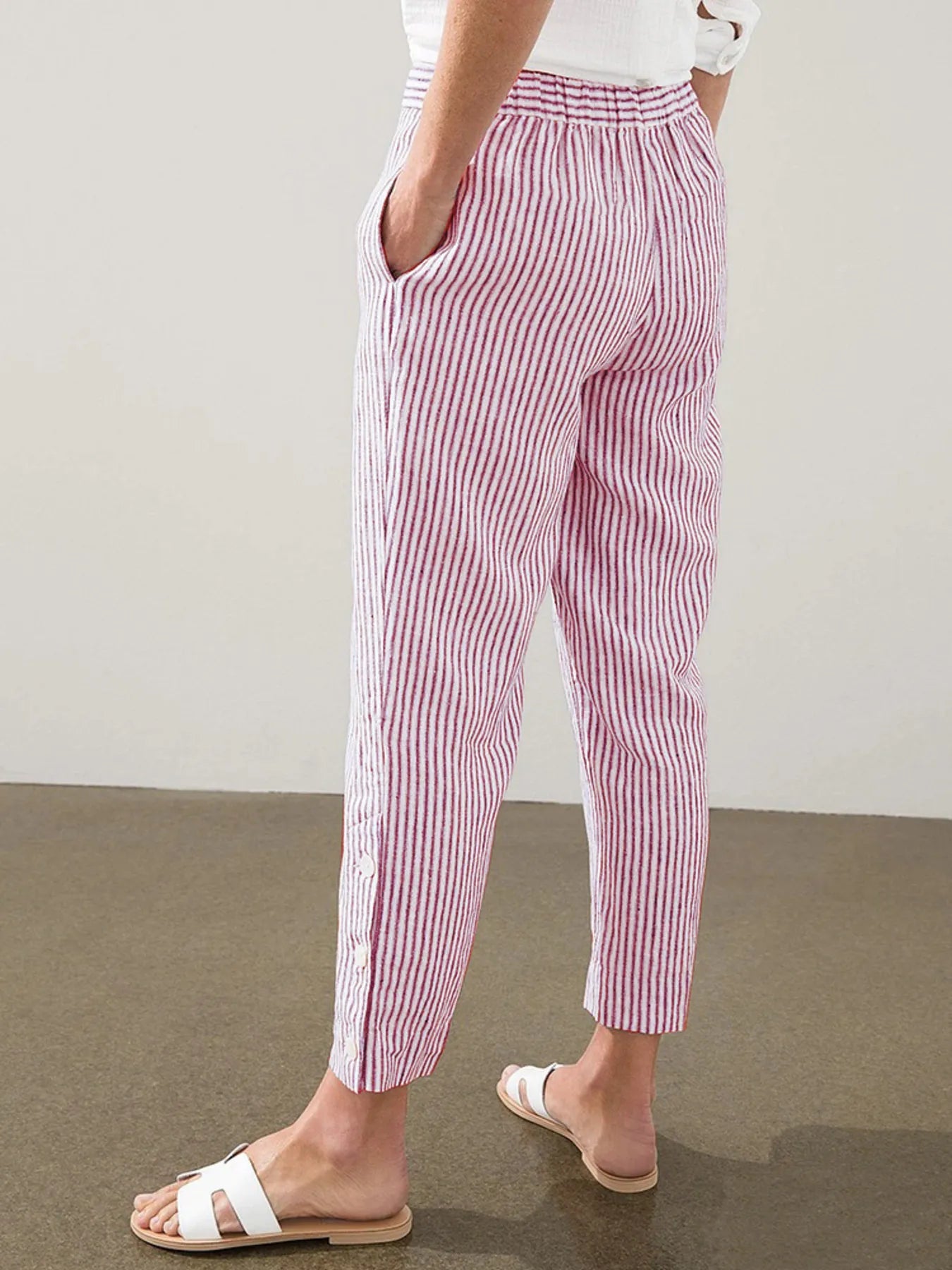Plus size striped side-button detail pants in pink and white, relaxed ankle fit