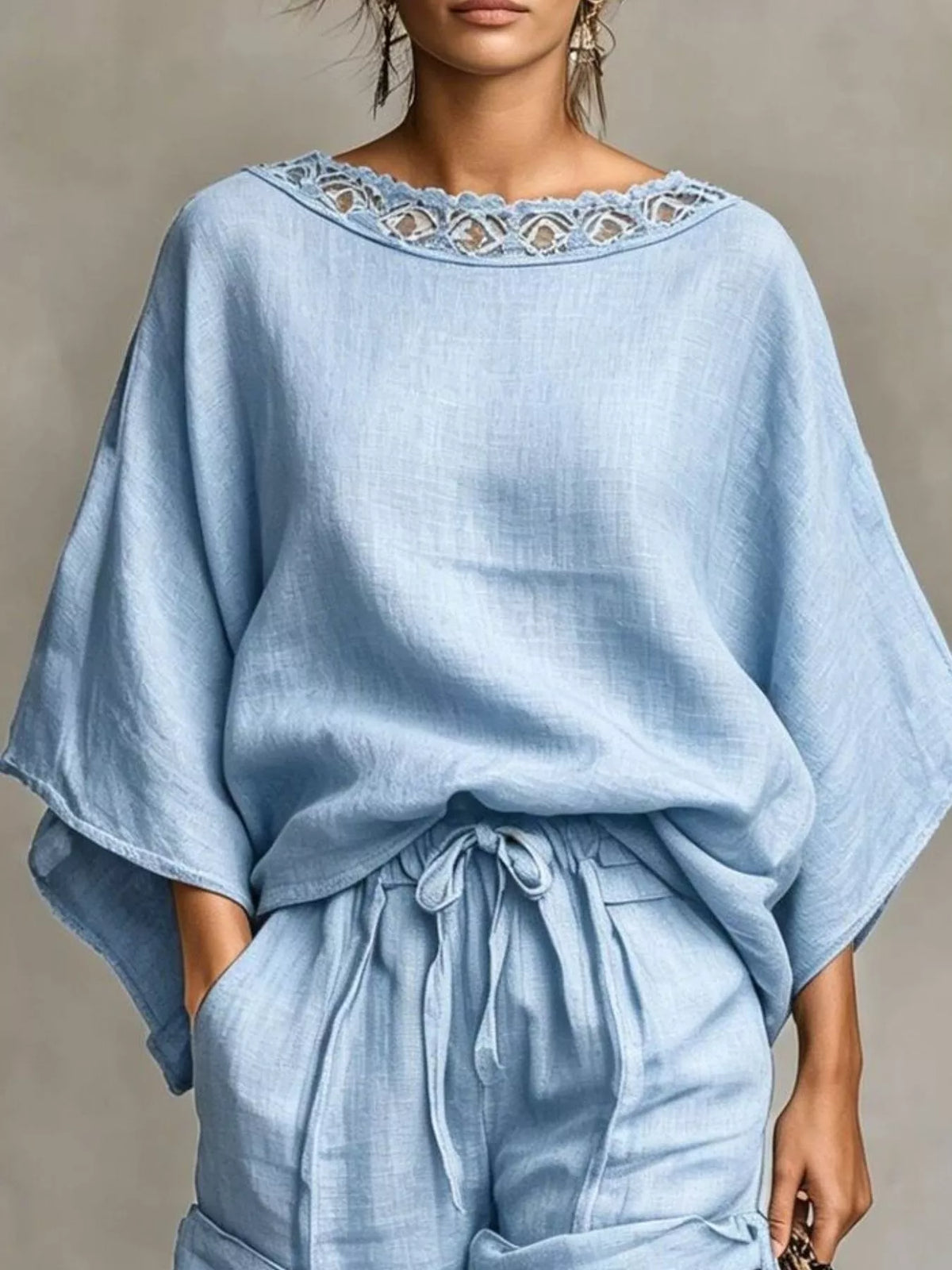 Light blue oversized lace neckline top with matching drawstring shorts, front view