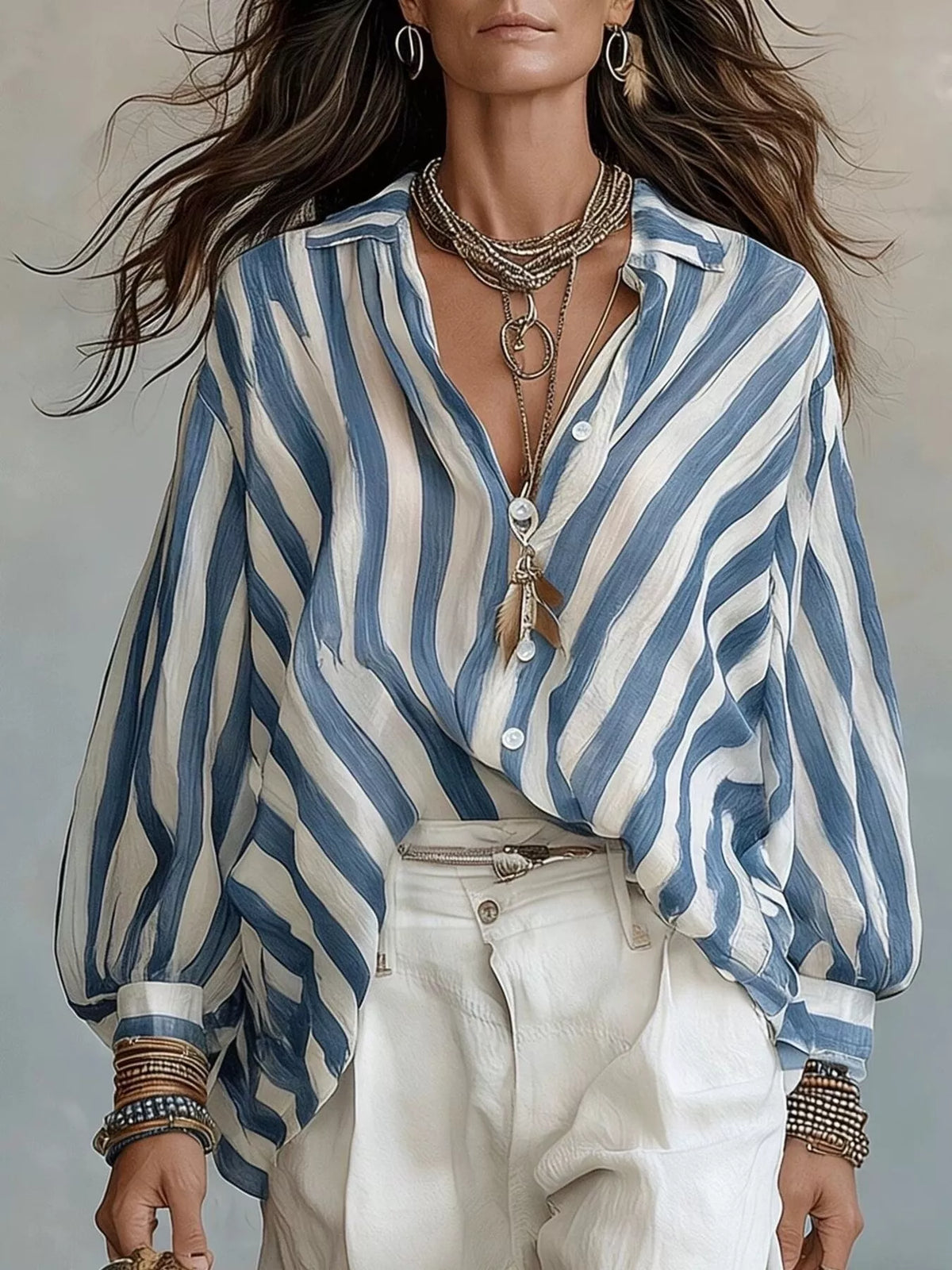 Blue and white striped loose button-down shirt with front buttons and long sleeves