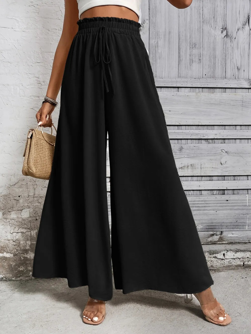 Black high waist wide-leg pants with elastic waistband and drawstring ties
