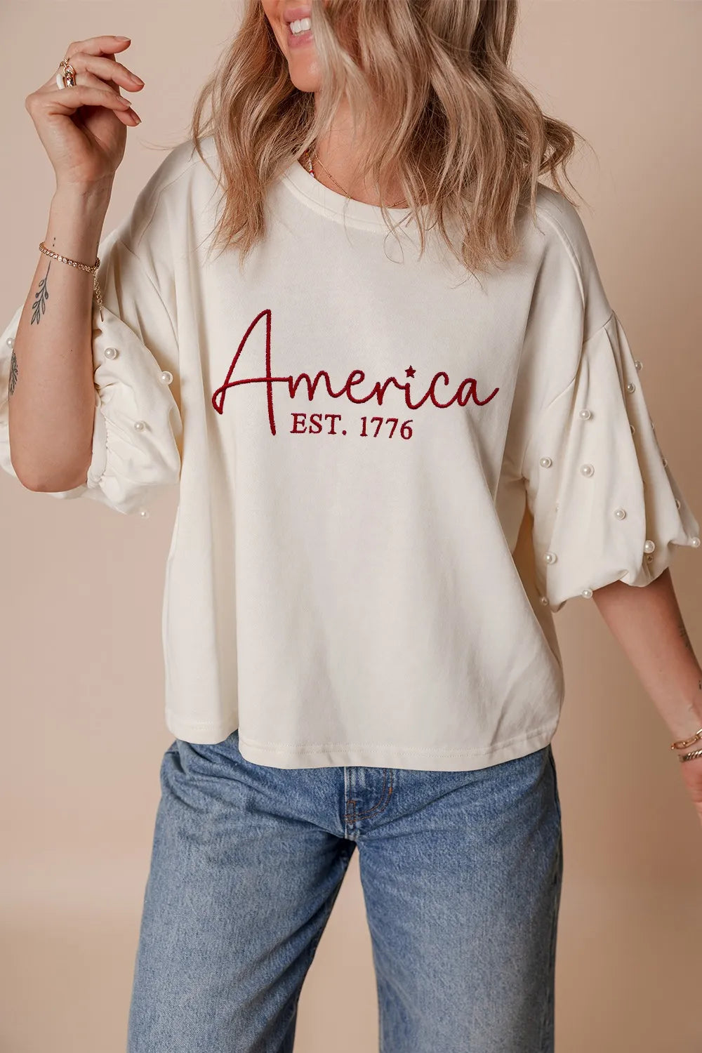 Cedar & Moore AMERICA EST 1776 Embroidered Pearl Beaded Sleeve T Shirt by Trendsi, white with pearl-beaded puff sleeves