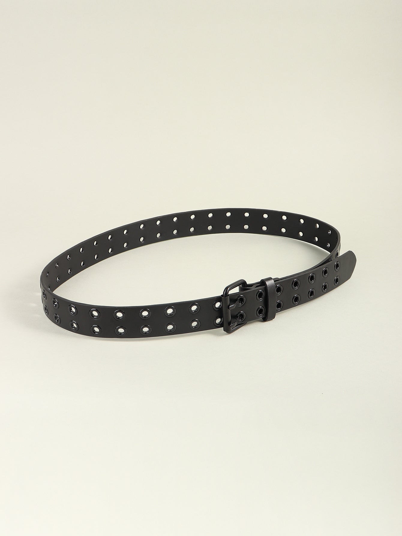 Black vegan leather grommet belt with square buckle, curved on white background