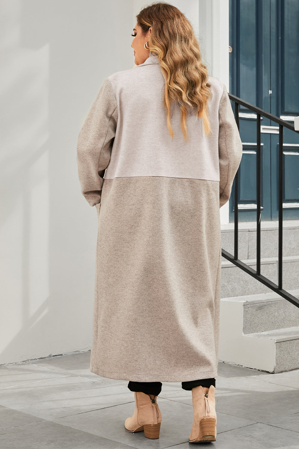 Dust storm longline collared coat in back view with long sleeves