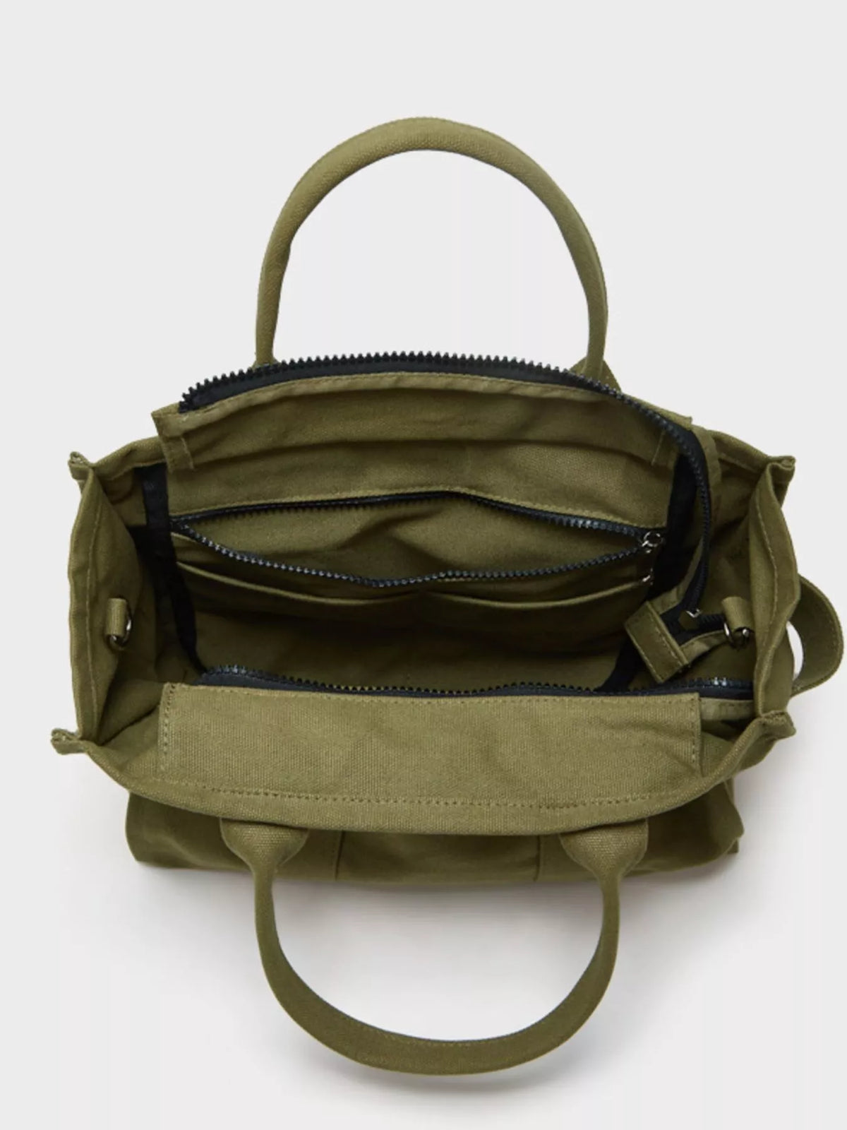 Army green canvas tote bag interior view with zipper pocket and side strap