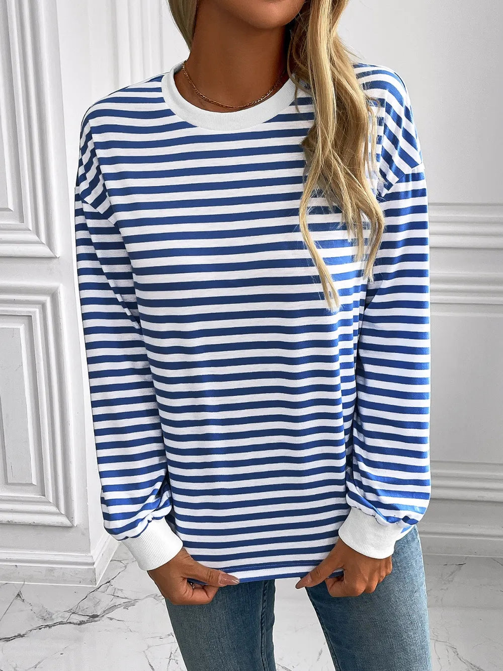 Striped crewneck long-sleeve sweatshirt in blue and white, front view