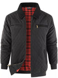 Black quilted zip-up jacket with plaid lining, stand collar, and zip pockets
