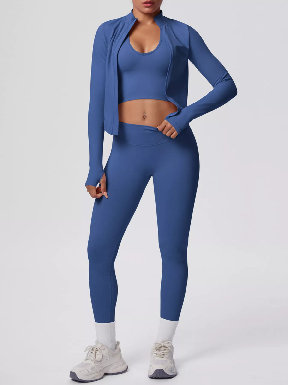 Royal blue seamless workout set: open-front jacket, cropped sports bra, and high-rise leggings.