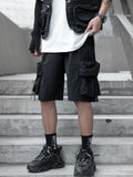 Black cargo shorts with flap pockets, relaxed fit, and drawstring waist