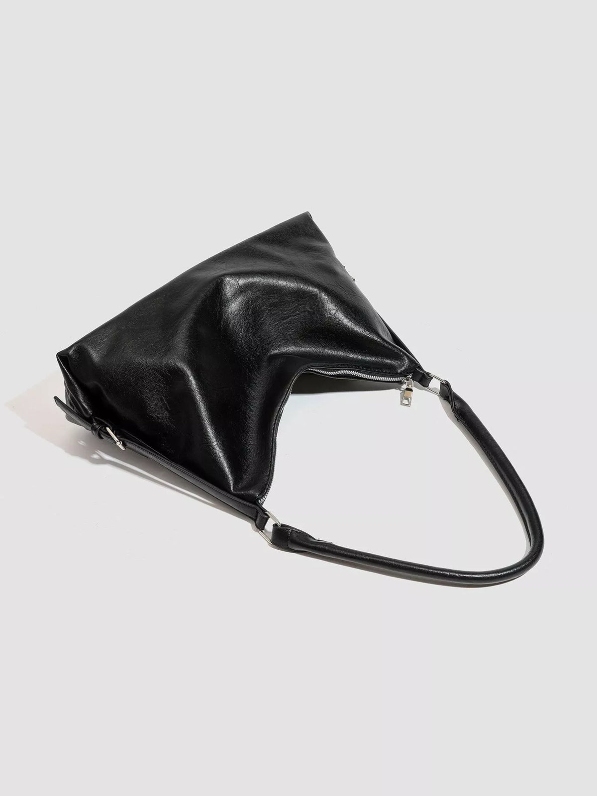 Black vegan leather pouch shoulder bag with top zip and long handle
