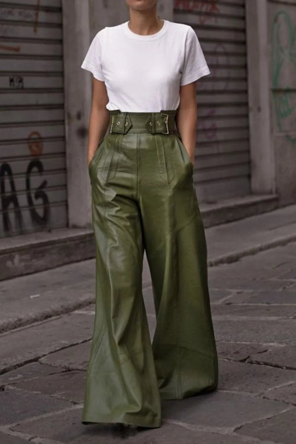 Moss green high-waist wide flare pants with structured seams and pockets