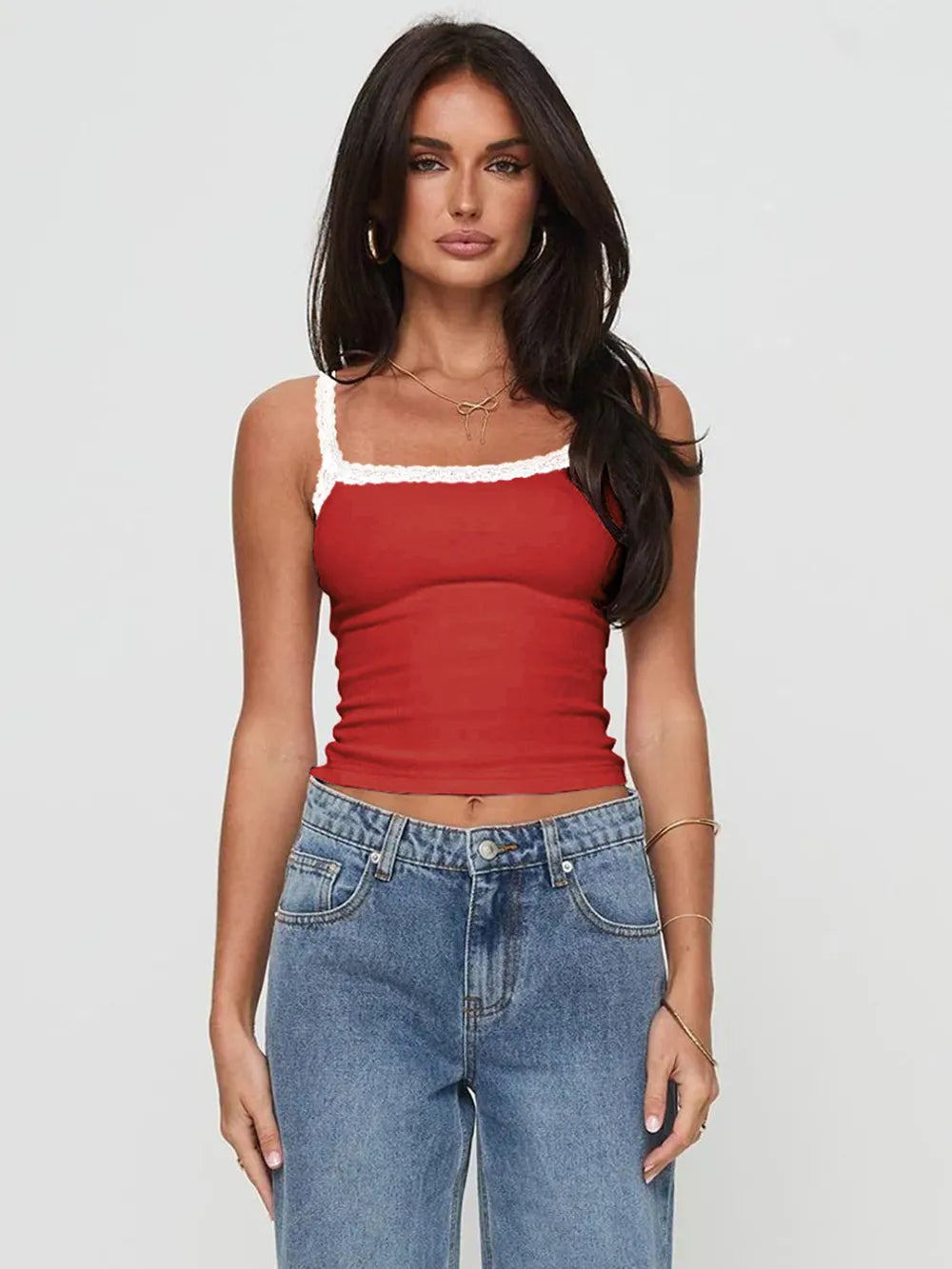 Deep red cropped cami with white lace trim at neckline and thin straps.