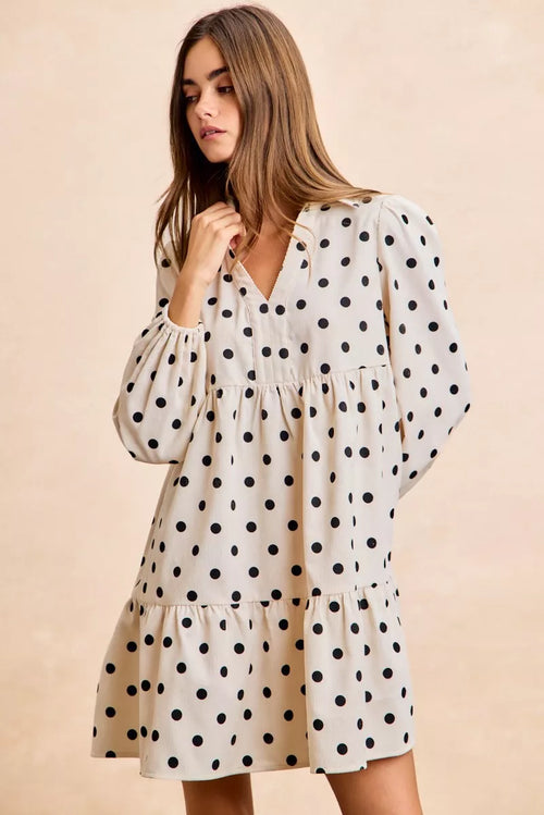 Ivory polka dot collared V-neck dress with long puff sleeves and tiered skirt