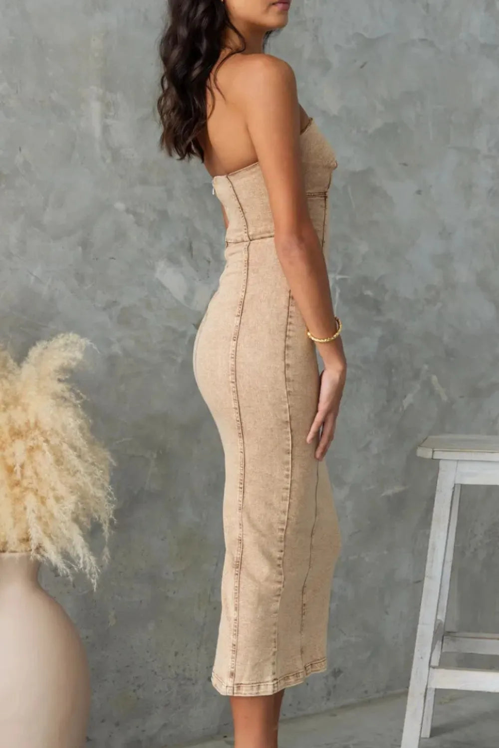 Tan washed denim tube dress with straight back, fitted seams, and slit