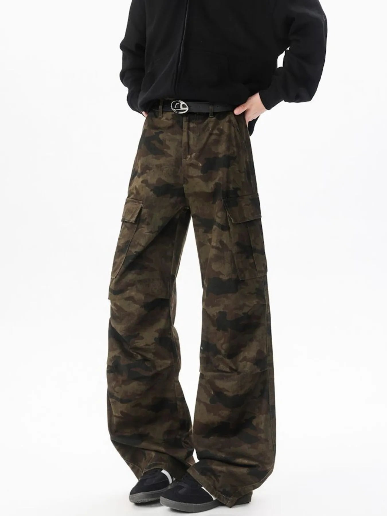 Camouflage wide-leg cargo pants with black belt and front flap pockets, relaxed straight legs