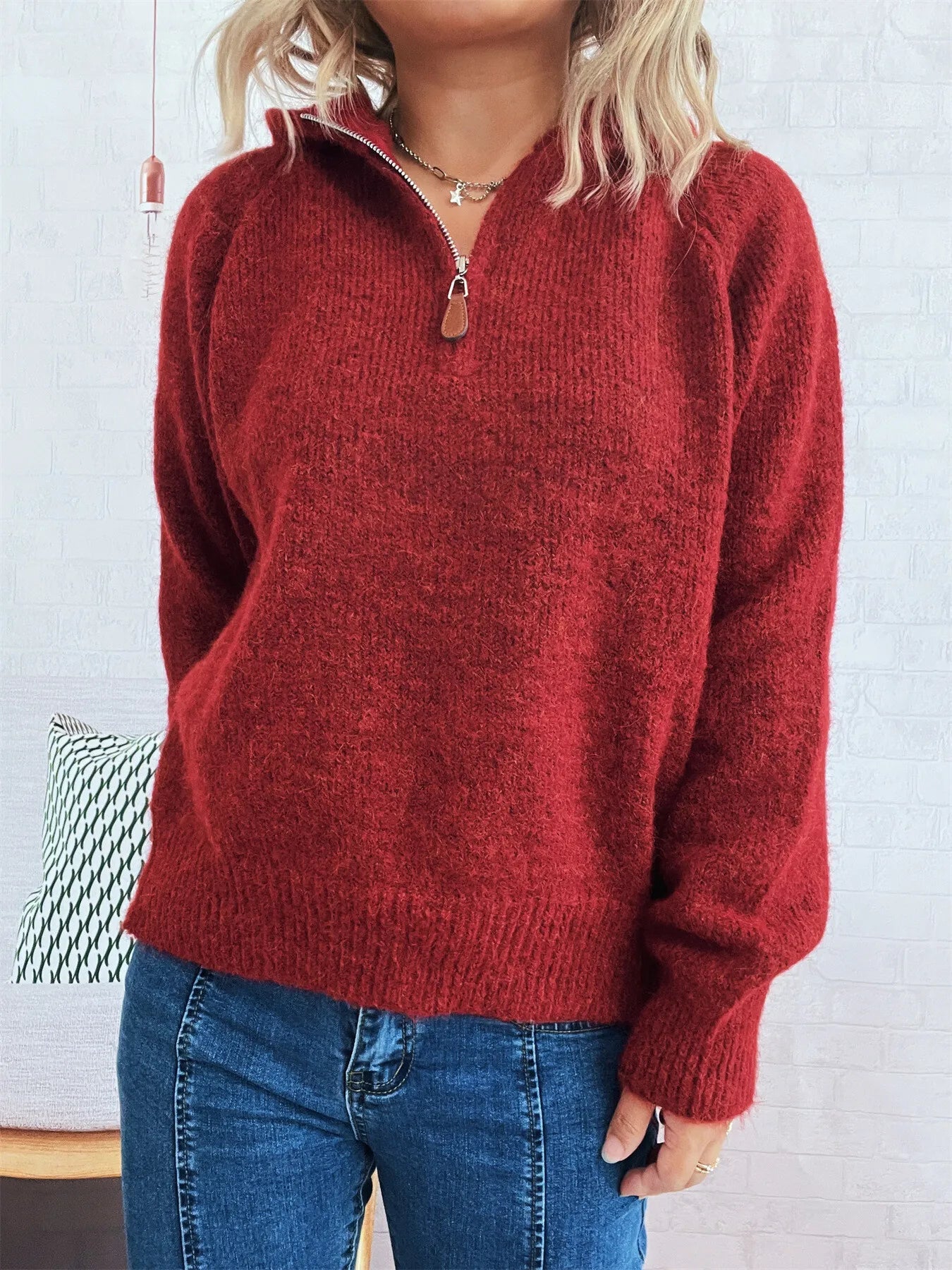 Burgundy quarter-zip pullover sweater with ribbed hem and soft knit texture