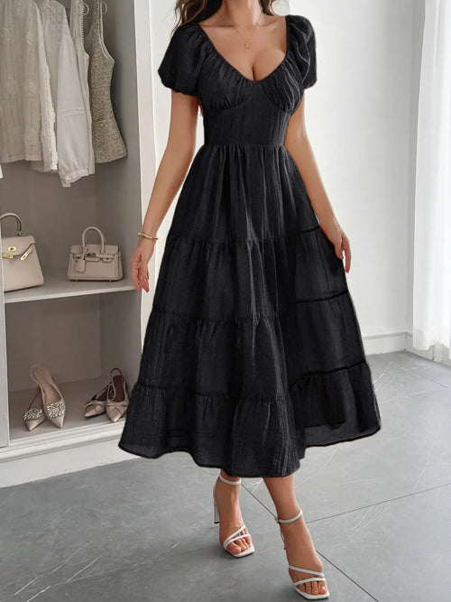 Black tiered midi dress with puff sleeves, V-neck front and cinched waist