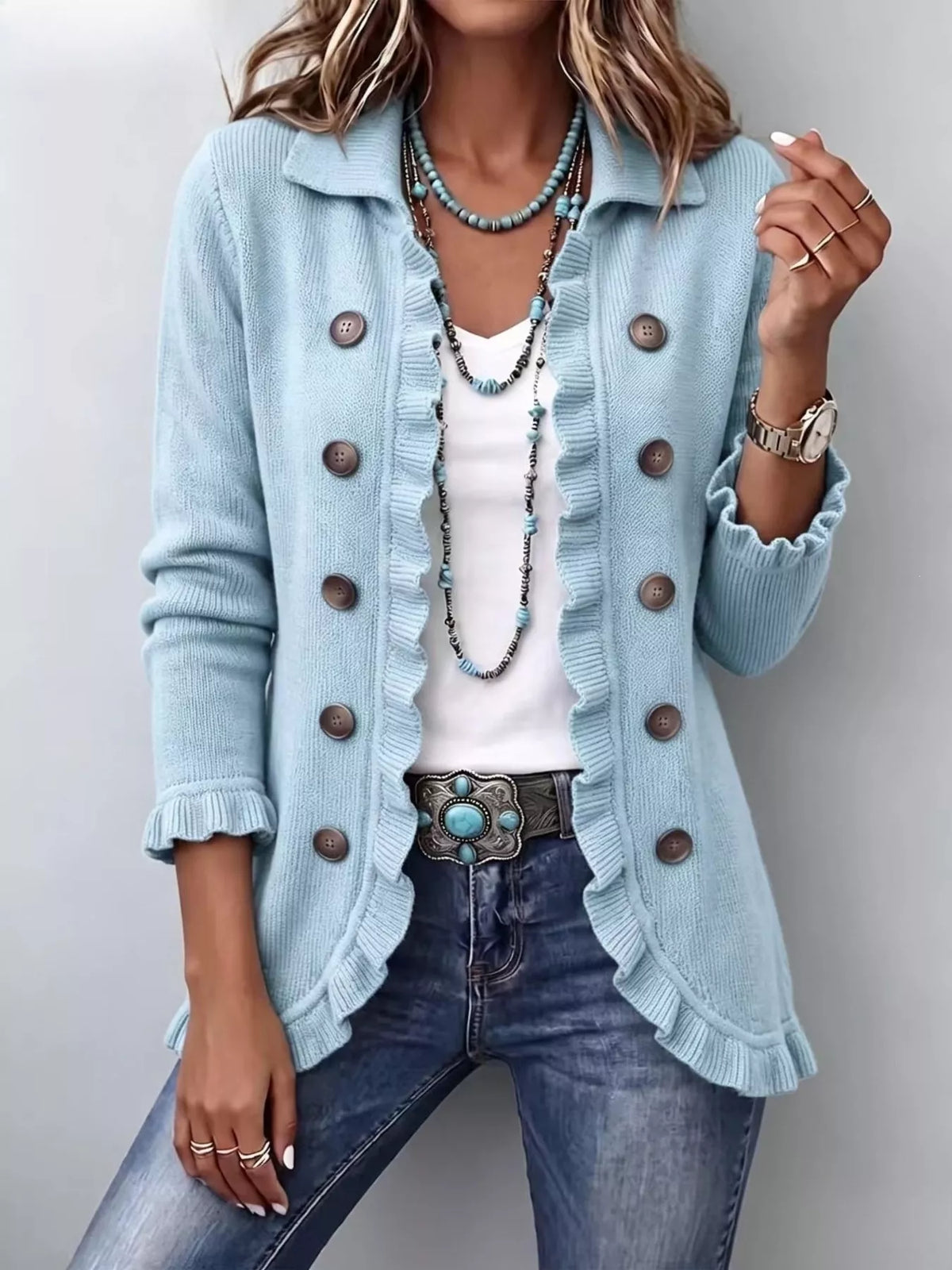 Light blue ribbed ruffled button cardigan sweater with brown buttons and scalloped edge