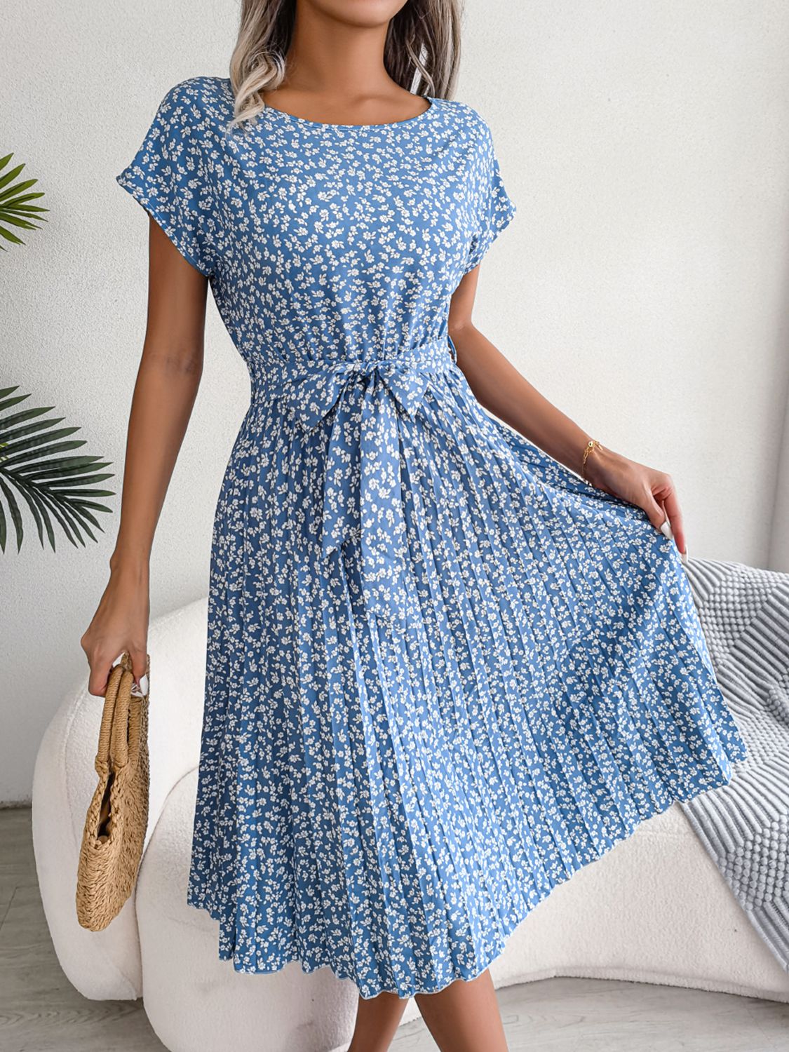 Ditsy floral pleated belted dress in sky blue with gathered waist and flared skirt