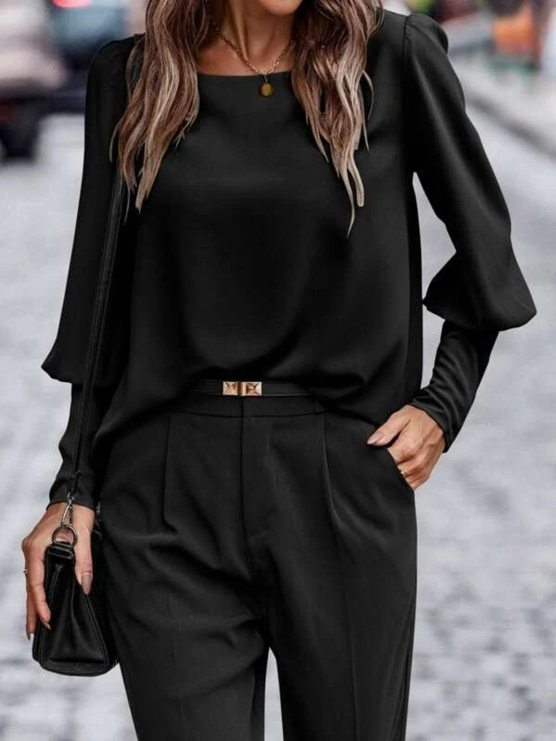 Black lantern-sleeve blouse with round neck and button-front placket