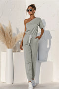Gray single-shoulder short-sleeve jumpsuit with drawstring waist and tapered legs