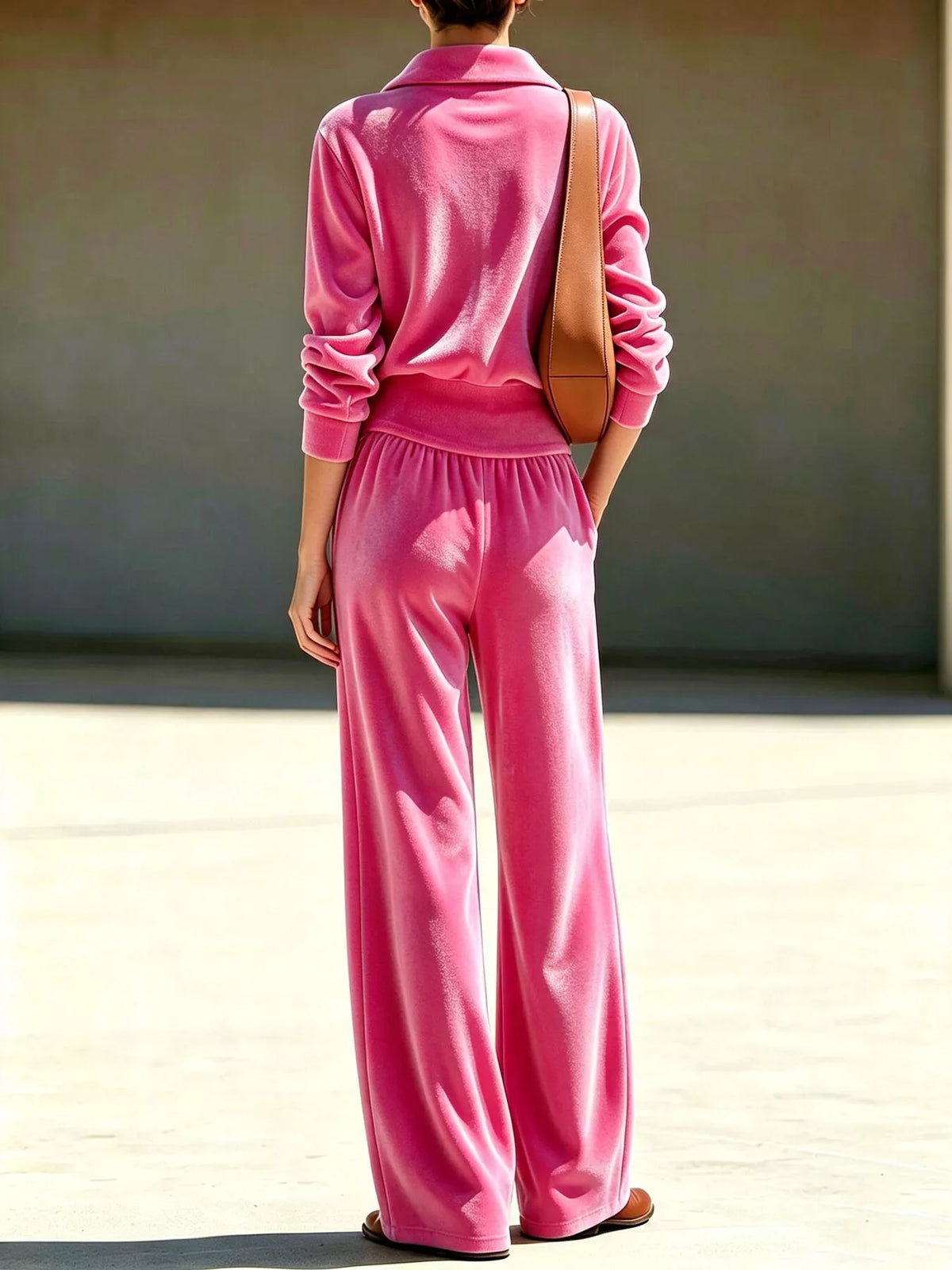 Fuchsia pink quarter-zip top and wide-leg pants from back view