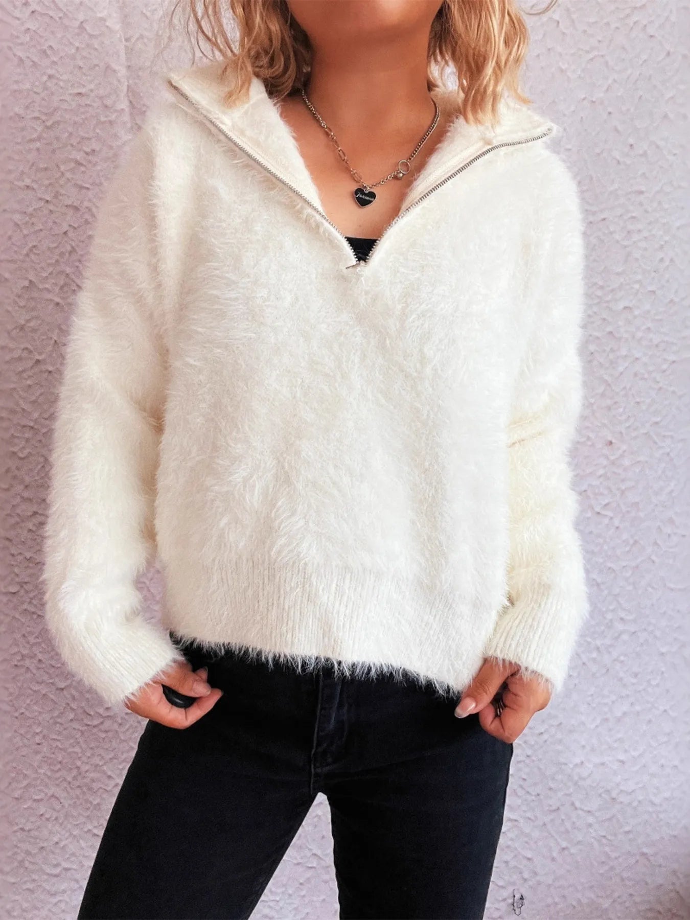 White fuzzy half-zip sweater with ribbed cuffs and ribbed hem