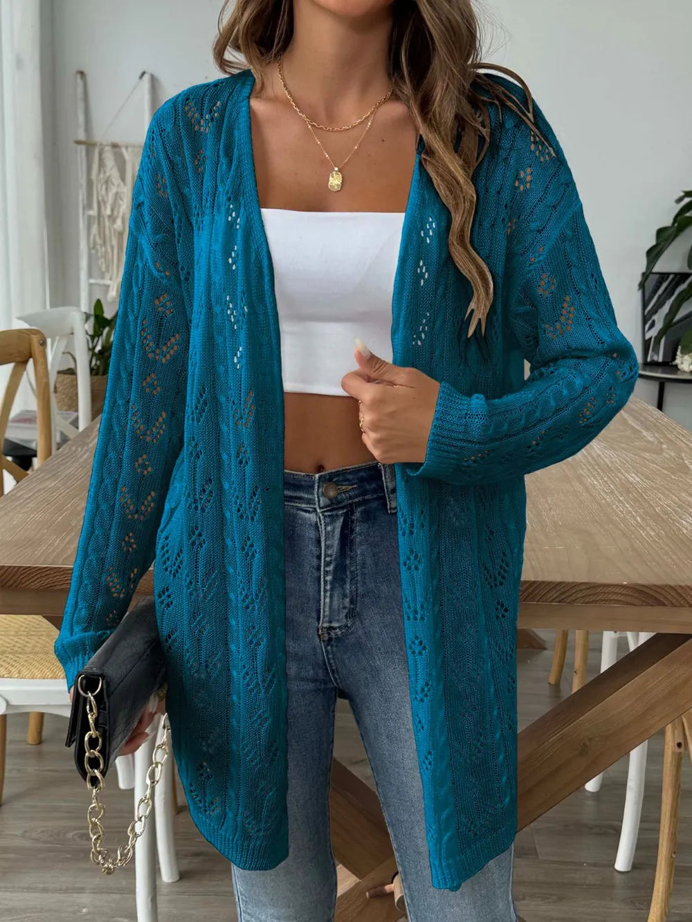 Gold openwork long-sleeve cardigan, open front, airy knit with scalloped edging.