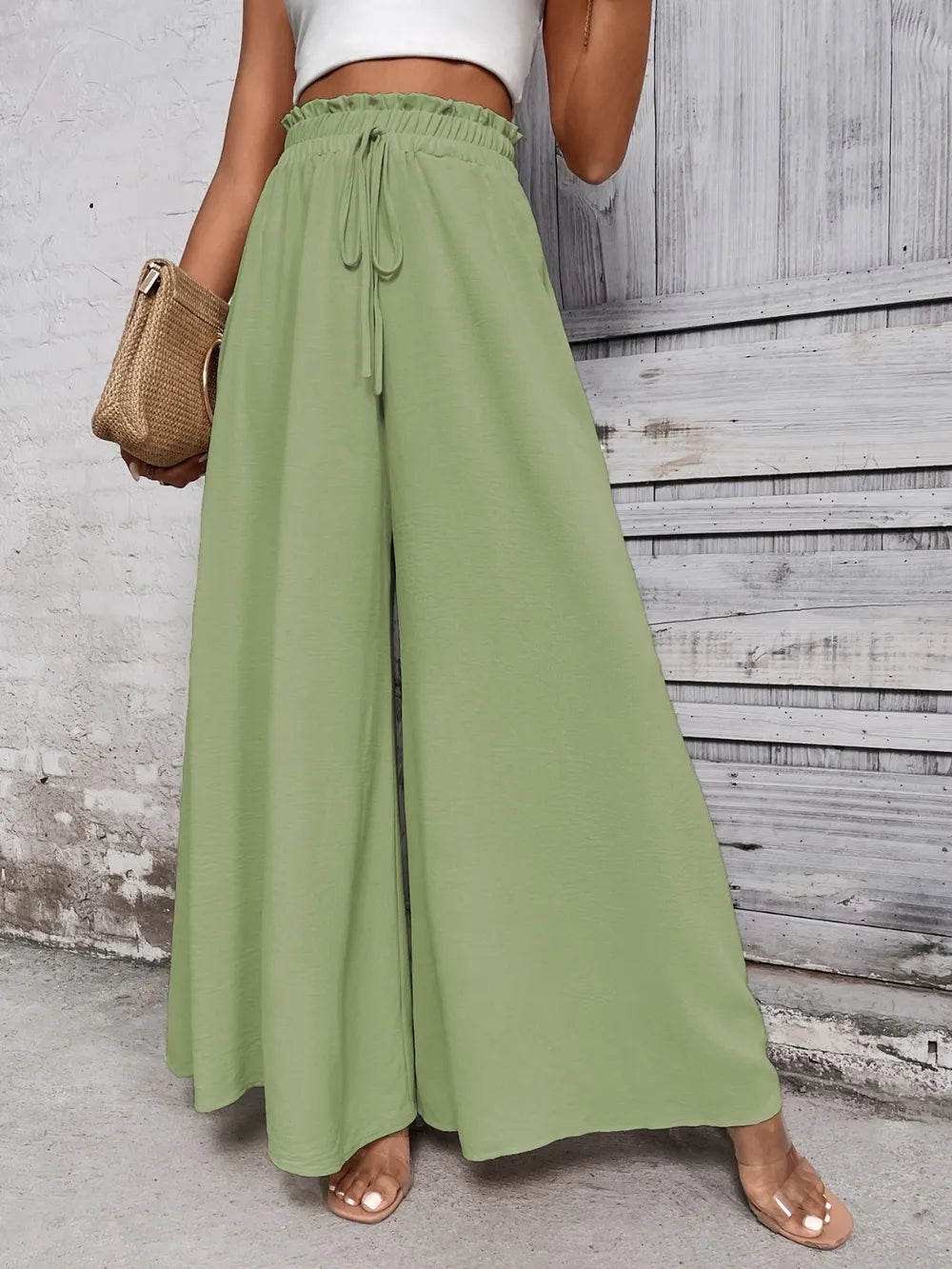 Light green high waist wide-leg pants with elastic waistband and drawstring ties