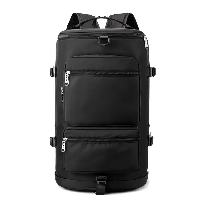 Black large travel backpack with two front zip compartments and top handle, front view.