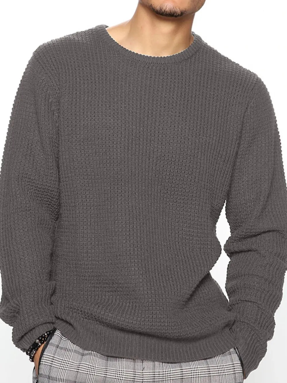Charcoal gray crewneck long-sleeve knit sweater with ribbed cuffs and hem
