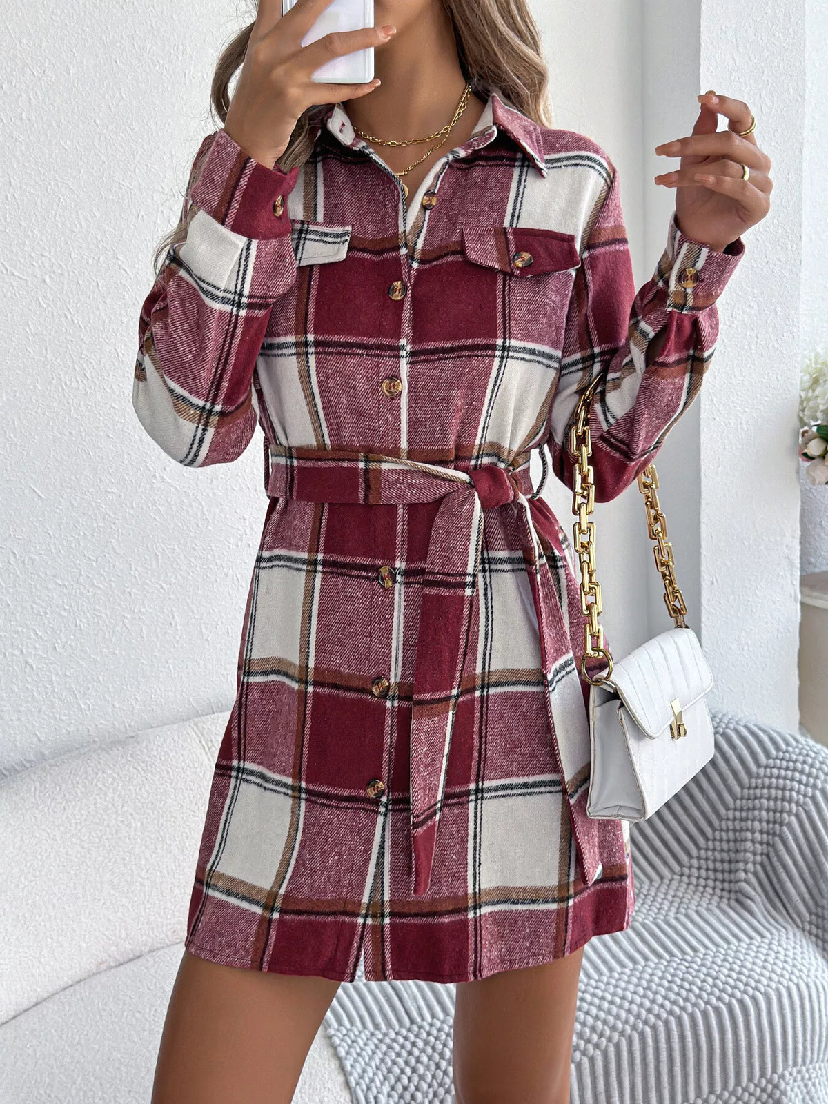 Burgundy plaid belted button shirt dress with collar, long sleeves, and front button placket.