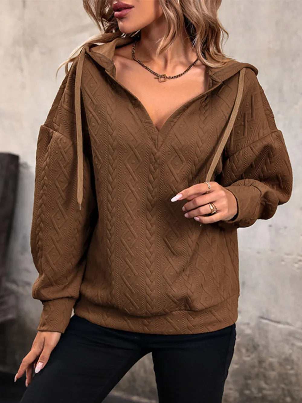 Brown drawstring hoodie with dropped shoulders, long sleeves, kangaroo pocket