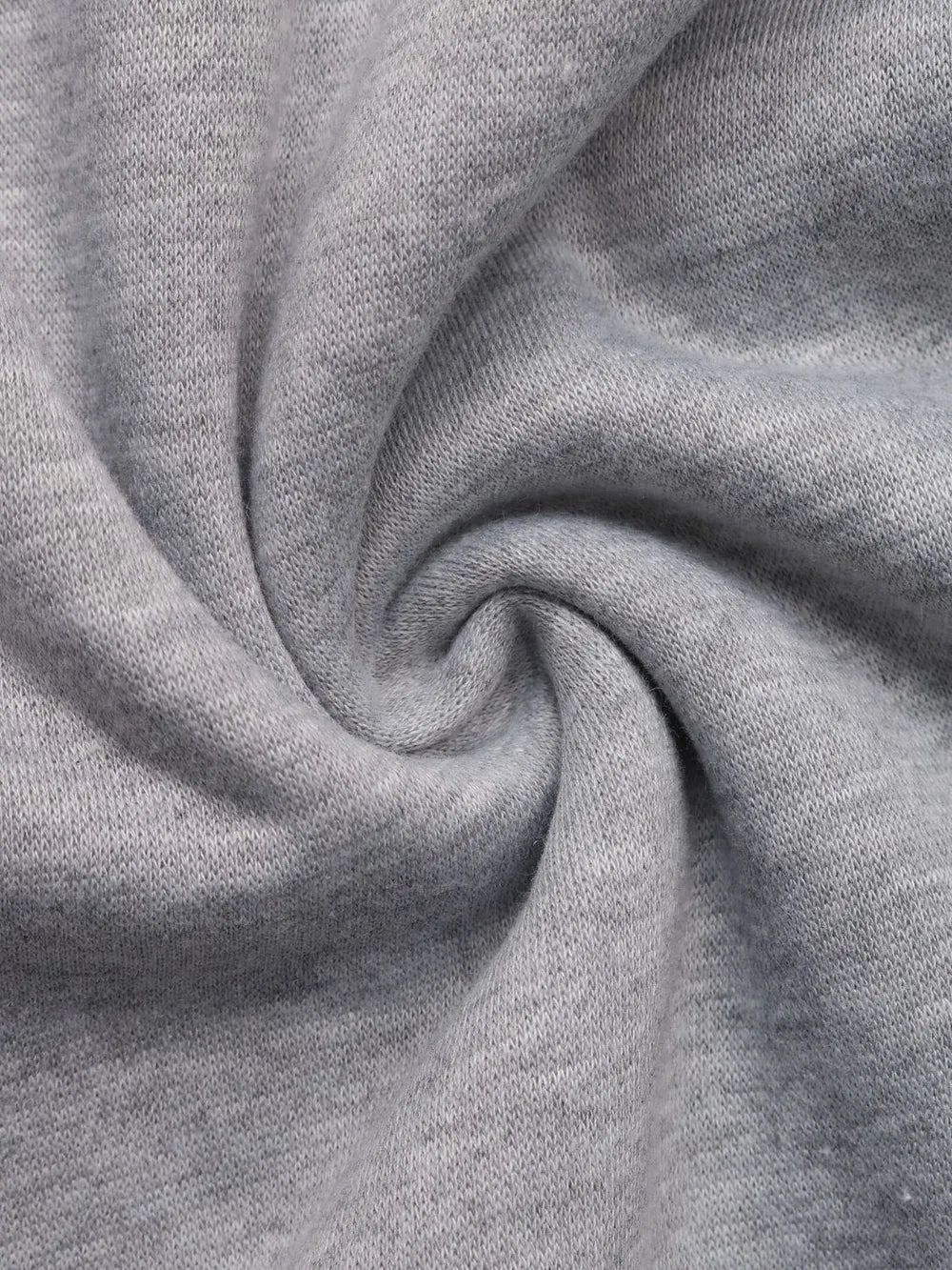 Light gray sweatshirt knit fabric close-up with soft textured weave