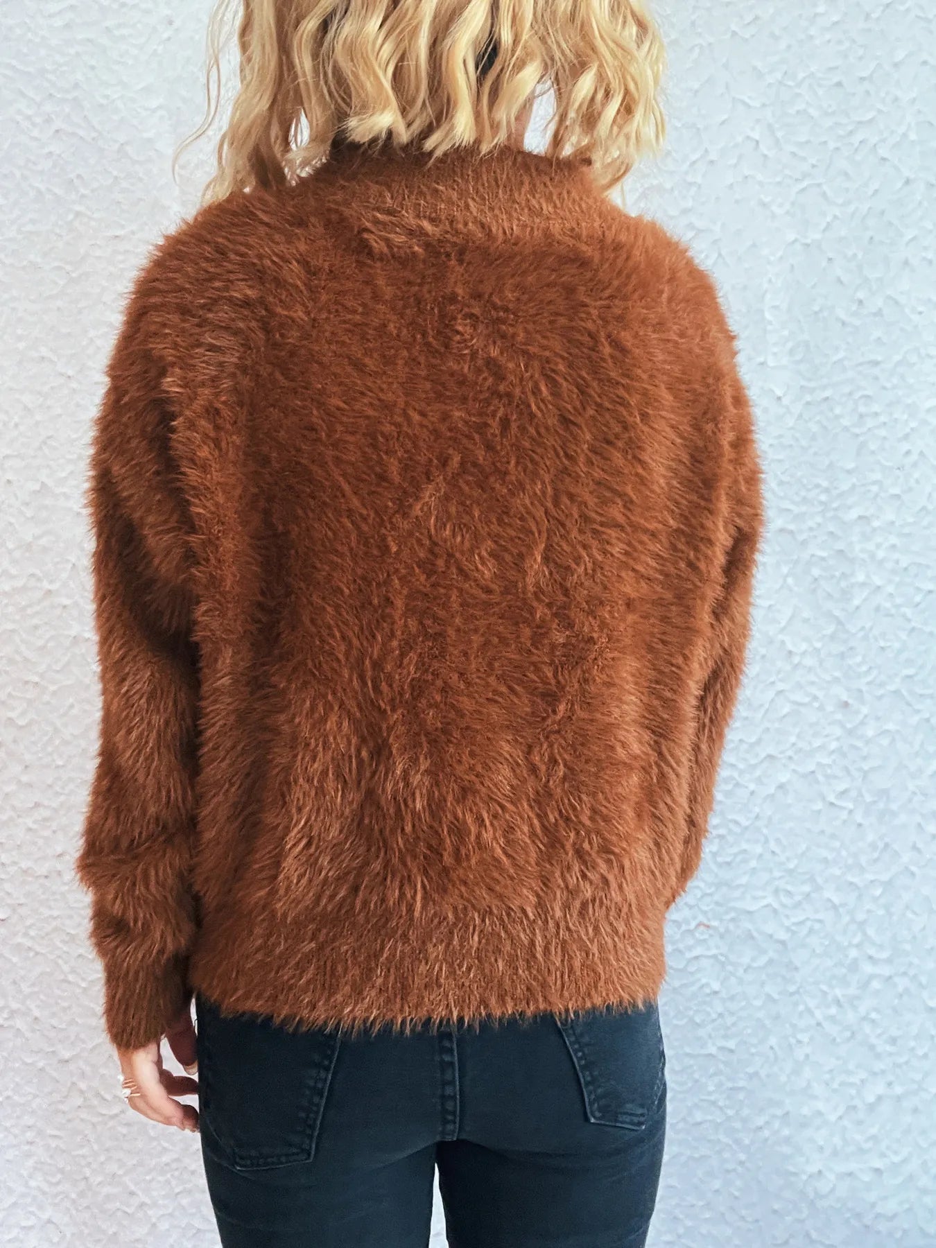 Brown fuzzy half-zip sweater, back view with ribbed hem
