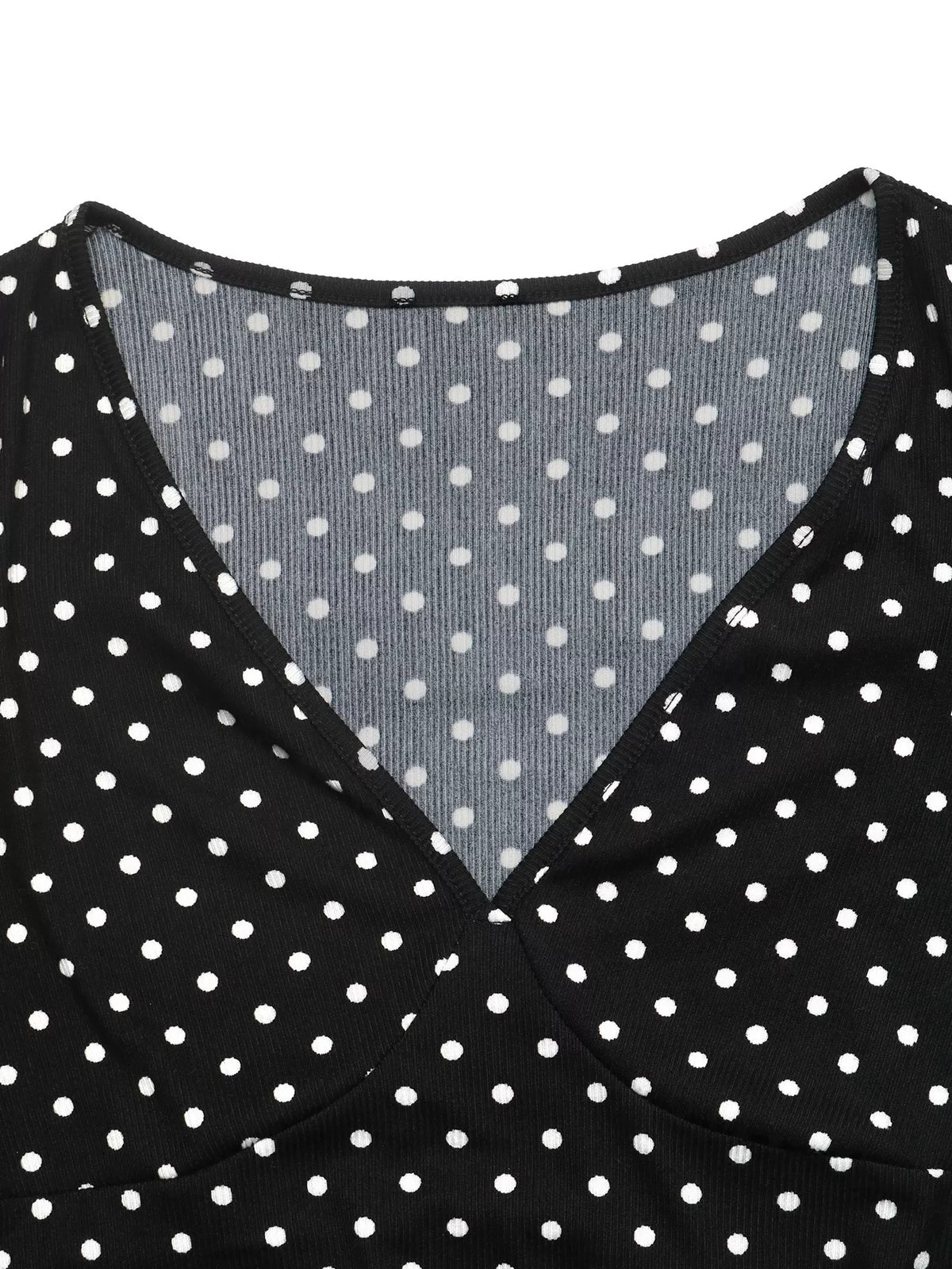 Black polka dot V-neck long-sleeve mini dress fabric close-up