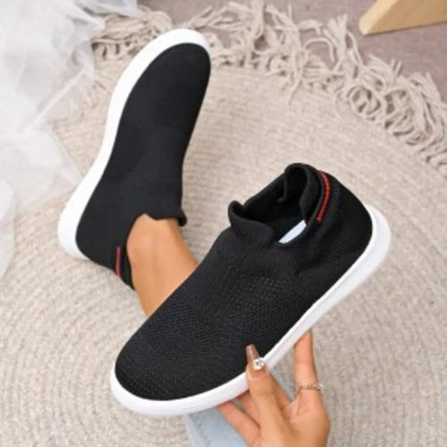 Black breathable knit slip-on shoes, side and front view, white sole